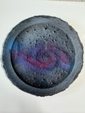 Round, textured coaster with a colourful swirl, the whirlpool galaxy
